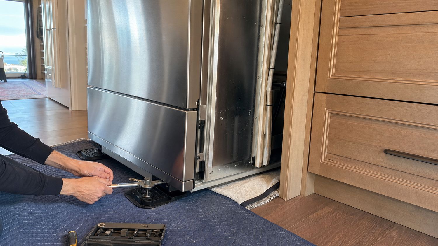 Built-in refrigerator service in a custom kitchen with protected floor runners
